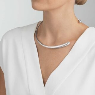 GJensen-20000069-MERCY-NECKRING-634D-SILVER-1200w-100KB Woman wearing Georg Jensen Mercy Neck Ring in sterling silver | Kneen & Co