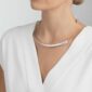 Woman wearing Georg Jensen Mercy Neck Ring in sterling silver | Kneen & Co