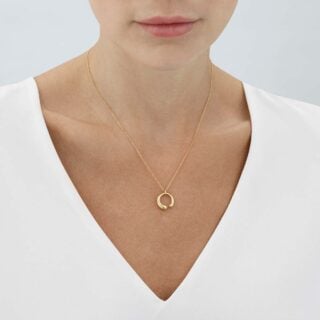 GJensen-20000686-MERCY-SMALL-PENDANT-1636A-YG-1200w-100KB Woman wearing Georg Jensen Mercy Necklace with Pendant in 18 kt yellow gold | Kneen & Co