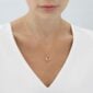Woman wearing Georg Jensen Mercy Necklace with Pendant in 18 kt yellow gold | Kneen & Co