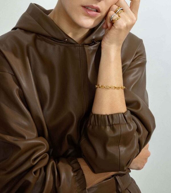 Georg Jensen Offspring Ring in sterling silver on model in brown jacket | Kneen & Co