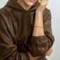 Georg Jensen Offspring Ring in sterling silver on model in brown jacket | Kneen & Co