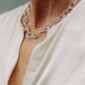 Woman wearing Georg Jensen Offspring Necklace in sterling silver | Kneen & Co