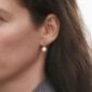 Woman wearing Georg Jensen Magic Earrings Gold with Pearls and 0.04 CT Diamonds | Kneen & Co