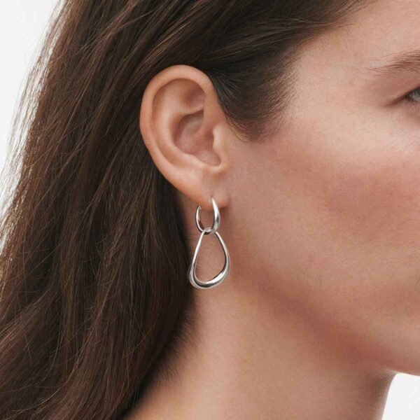GJ-SS25-ECOM-SHOOT-OFFSPRING-EARRING-10012754-Close-up-1200w-100KB Georg Jensen Offspring Interlocked Earrings in sterling silver on model with brown hair | Kneen & Co