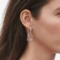 Georg Jensen Offspring Interlocked Earrings in sterling silver on model with brown hair | Kneen & Co