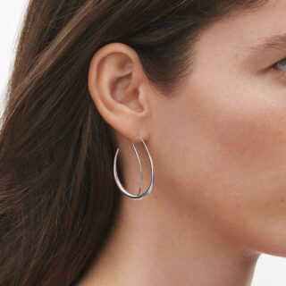 Georg Jensen Offspring Double Earhoops in sterling silver close up on model | Kneen & Co