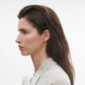 Georg Jensen Offspring Double Earhoops in 18 kt yellow gold on model | Kneen & Co