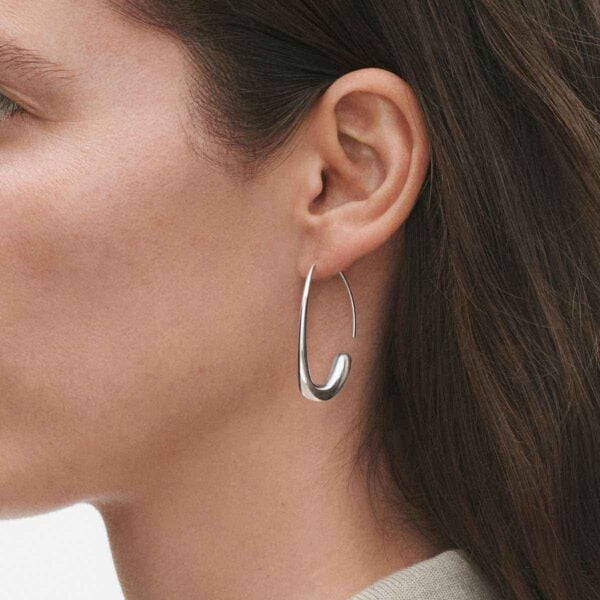 Georg Jensen Offspring Open Earhoops in sterling silver close up on model | Kneen & Co
