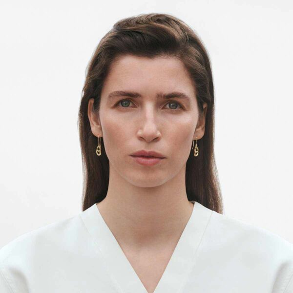 Georg Jensen Offspring Earring in 18 ct yellow gold on model | Kneen & Co
