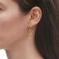 Georg Jensen Offspring Earrings Gold with Pavé Diamonds .11ct close up on model | Kneen & Co