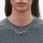 Georg Jensen Offspring Necklace in sterling silver on model with gray sweater | Kneen & Co