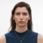 Georg Jensen Offspring Necklace with Pendant in 18kt yellow gold on model | Kneen & Co