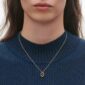 Georg Jensen Offspring Necklace with Pendant in 18kt yellow gold on model close up | Kneen & Co