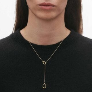 Georg Jensen Offspring Lariat Necklace in 18 kt yellow gold on model close up | Kneen & Co