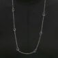 Woman wearing Georg Jensen Offspring Sautoir Necklace in sterling silver