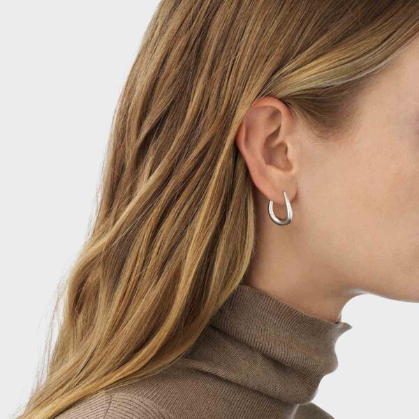 Georg Jensen Offspring Medium Earhoops Silver on model | Kneen & Co