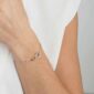 Georg Jensen Offspring Bracelet in sterling silver and 18 kt rose gold on model | Kneen & Co