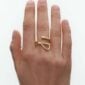 Georg Jensen Mercy Ring 1636D in 18 kt yellow gold shown on hand closeup | Kneen & Co