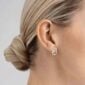 Woman wearing Georg Jensen Offspring Earstud in sterling silver | Kneen & Co