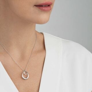 Georg Jensen Offspring Large Pendant Necklace in Sterling Silver shown on model | Kneen & Co
