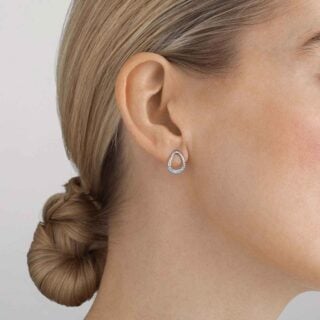 GJensen-10015849-OFFSPRING-EARSTUD-1200w-100KB Georg Jensen Offspring Woman wearing Earstud in sterling silver with 0.19 ct pavé diamonds | Kneen & Co