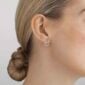 Georg Jensen Offspring Woman wearing Earstud in sterling silver with 0.19 ct pavé diamonds | Kneen & Co
