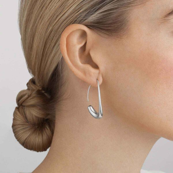 Georg Jensen Offspring Open Earhoops in sterling silver close up on model | Kneen & Co