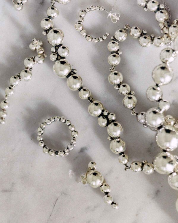 GJ-SS25-BRAND-CAMPAIGN-MG-20001008-4X5-1200w-100KB Georg Jensen Moonlight Grapes Necklace 551I in Sterling Silver | Kneen & Co