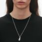 Woman wearing Georg Jensen Reflect Medium Pendant Necklace Silver | Kneen & Co