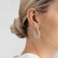 Woman wearing Georg Jensen Earhoop Silver | Kneen & Co