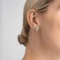 Woman wearing Georg Jensen Infinity Earrings Silver | Kneen & Co
