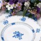 Herend Blue Garden Dinnerware set on table with flowers | Kneen & Co