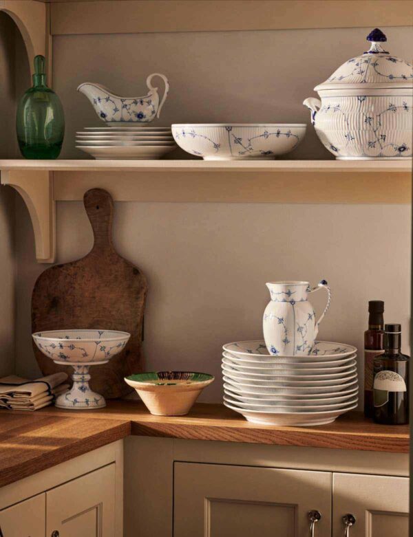 Royal Copenhagen Blue Fluted Plain dinnerware stacked on shelf | Kneen & Co