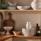 Royal Copenhagen Blue Fluted Plain dinnerware stacked on shelf | Kneen & Co
