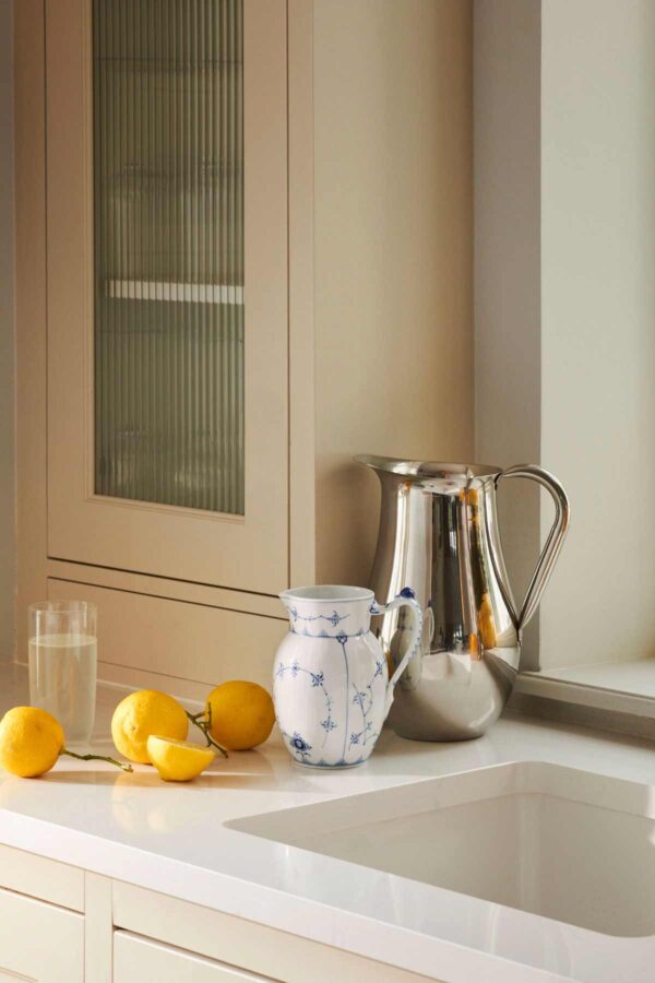 2023_Exclusives_Blue_Fluted_Plain_Jug_90cl_300dpi Royal Copenhagen Blue Fluted Plain Jug set on kitchen counter | Kneen & Co