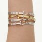 Woman wearing Georg Jensen Torun Bangle assortment | Kneen & Co