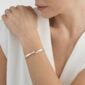 Woman wearing Georg Jensen Torun Bangle Silver & Gold | Kneen & Co