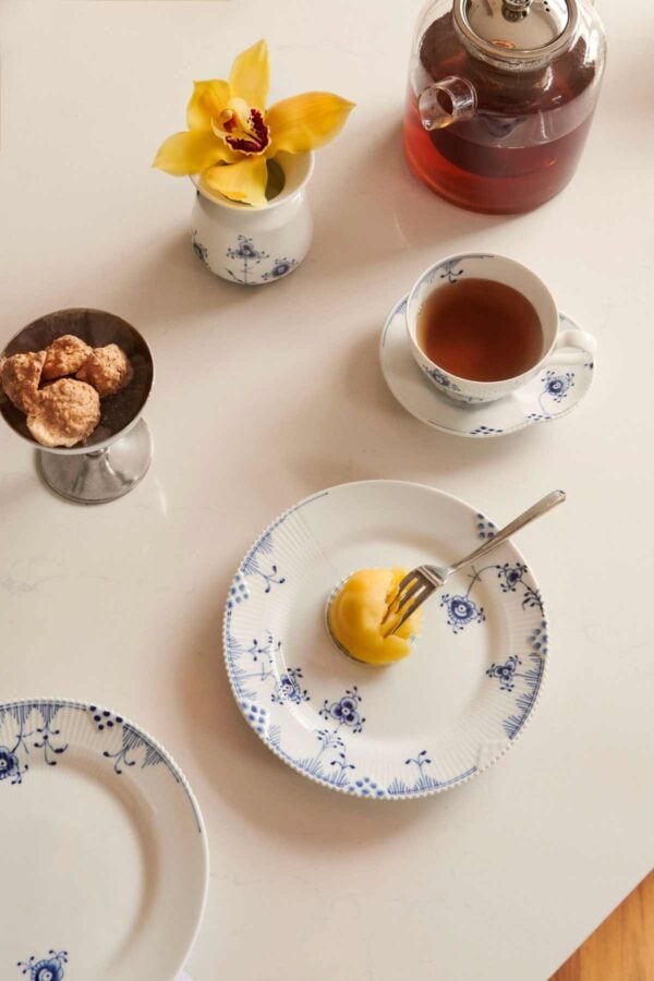 RC-2023-Exclusives-BlueElements-Plate-19cm-Vase-10cm-Cup-and-Saucer-26cl-1200w-100KB Royal Copenhagen Blue Elements Dinnerware. set on table | Kneen & Co