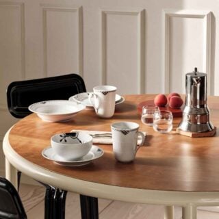 Royal Copenhagen Black Lace Dinnerware and Black Fluted Mega Dinnerware Collections set on table | Kneen & Co