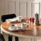 Royal Copenhagen Black Lace Dinnerware and Black Fluted Mega Dinnerware Collections set on table | Kneen & Co