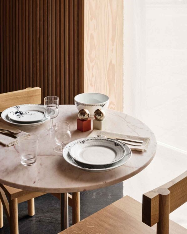 Royal Copenhagen Black Lace Dinnerware and Black Fluted Mega Dinnerware Collections set on table | Kneen & Co