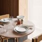 Royal Copenhagen Black Lace Dinnerware and Black Fluted Mega Dinnerware Collections set on table | Kneen & Co