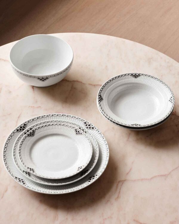 Royal Copenhagen Black Lace Dinnerware Collection set on table | Kneen & Co