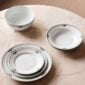 Royal Copenhagen Black Lace Dinnerware Collection set on table | Kneen & Co