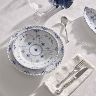 Royal Copenhagen Blue Fluted Full Lace Dinnerware set on table | Kneen & Co