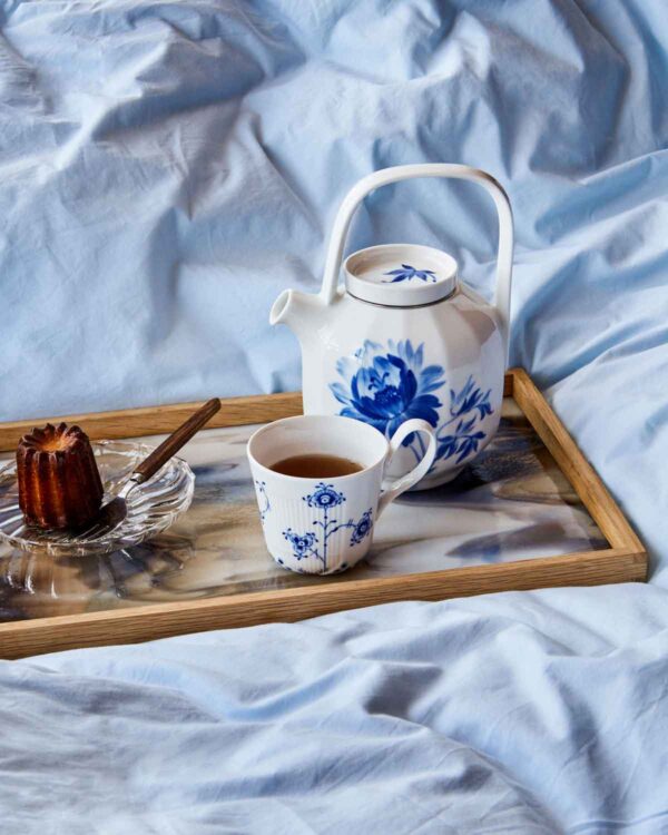 RC-S1-Line-Ext-BlueElements-Cup-25cl-Blomst-Teapot-Tree-Peony-100cl-1200w-100KB Royal Copenhagen Blue Elements Tea Service on tray set on bed | Kneen & Co