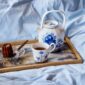 Royal Copenhagen Blue Elements Tea Service on tray set on bed | Kneen & Co