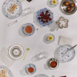 Royal Copenhagen Blue Fluted Half Lace Dinnerware set on table | Kneen & Co