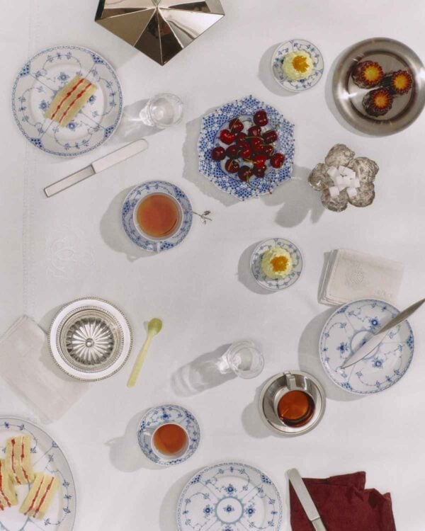 Royal Copenhagen Blue Fluted Half Lace Dinnerware set on table | Kneen & Co